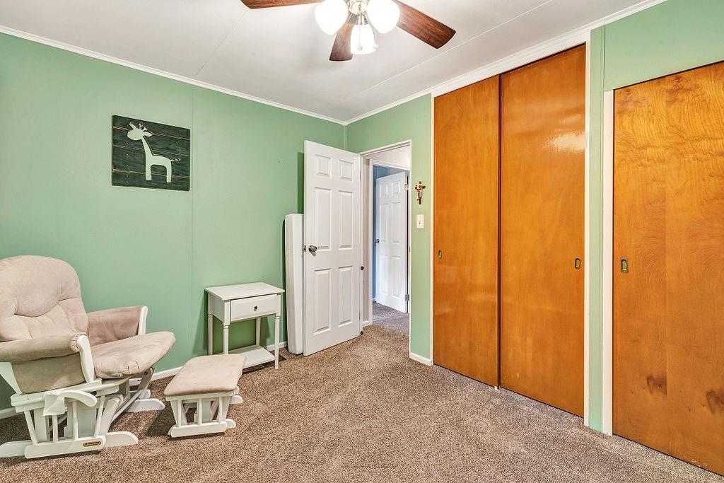 110 Maple Drive Beaver, PA 15009 - Photo 11 of 23 a living room with furniture a window and a ceiling fan