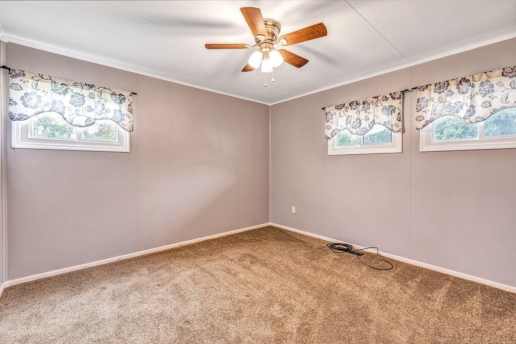110 Maple Drive Beaver, PA 15009 - Photo 12 of 23 an empty room with windows and fan