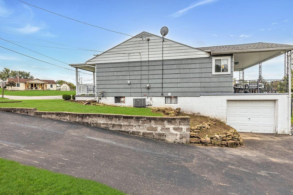 110 Maple Drive Beaver, PA 15009 - Photo 19 of 23 a front view of a house with a garden and pathway