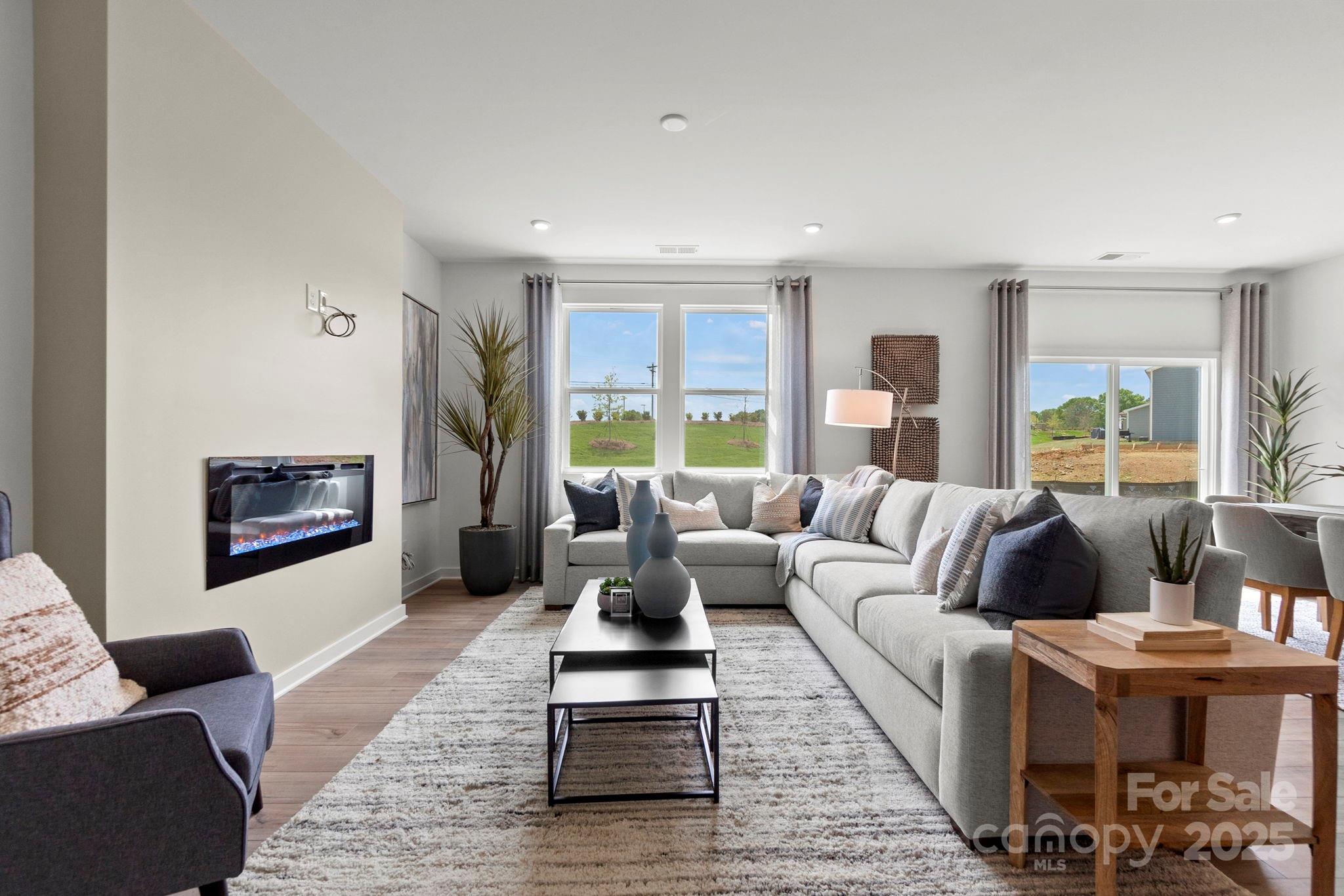 2573 Blue Sky Mdws Drive Monroe, NC 28110 - Photo 14 of 45 a living room with furniture and a large window