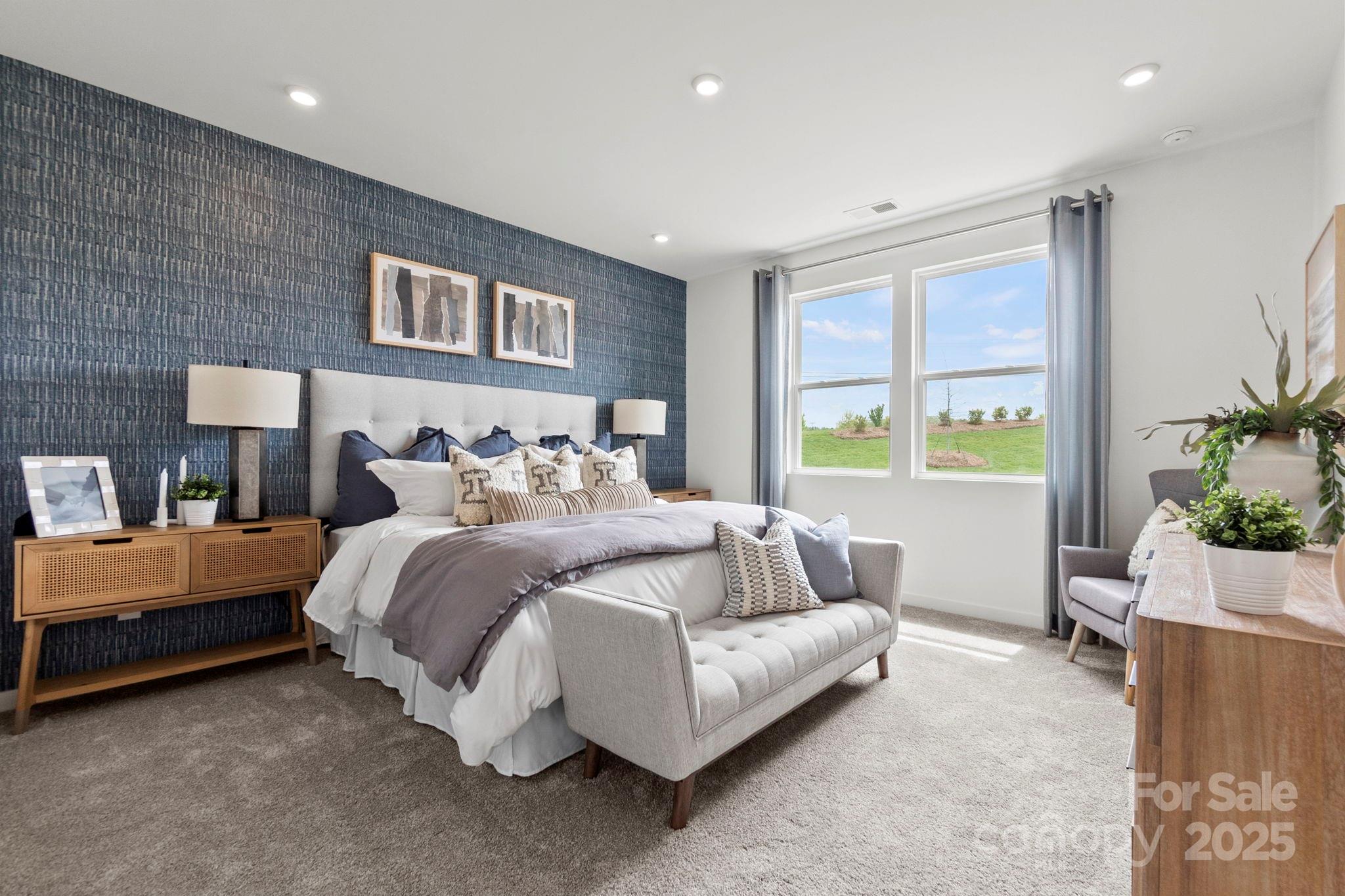 2573 Blue Sky Mdws Drive Monroe, NC 28110 - Photo 16 of 45 a spacious bedroom with a bed and a couch