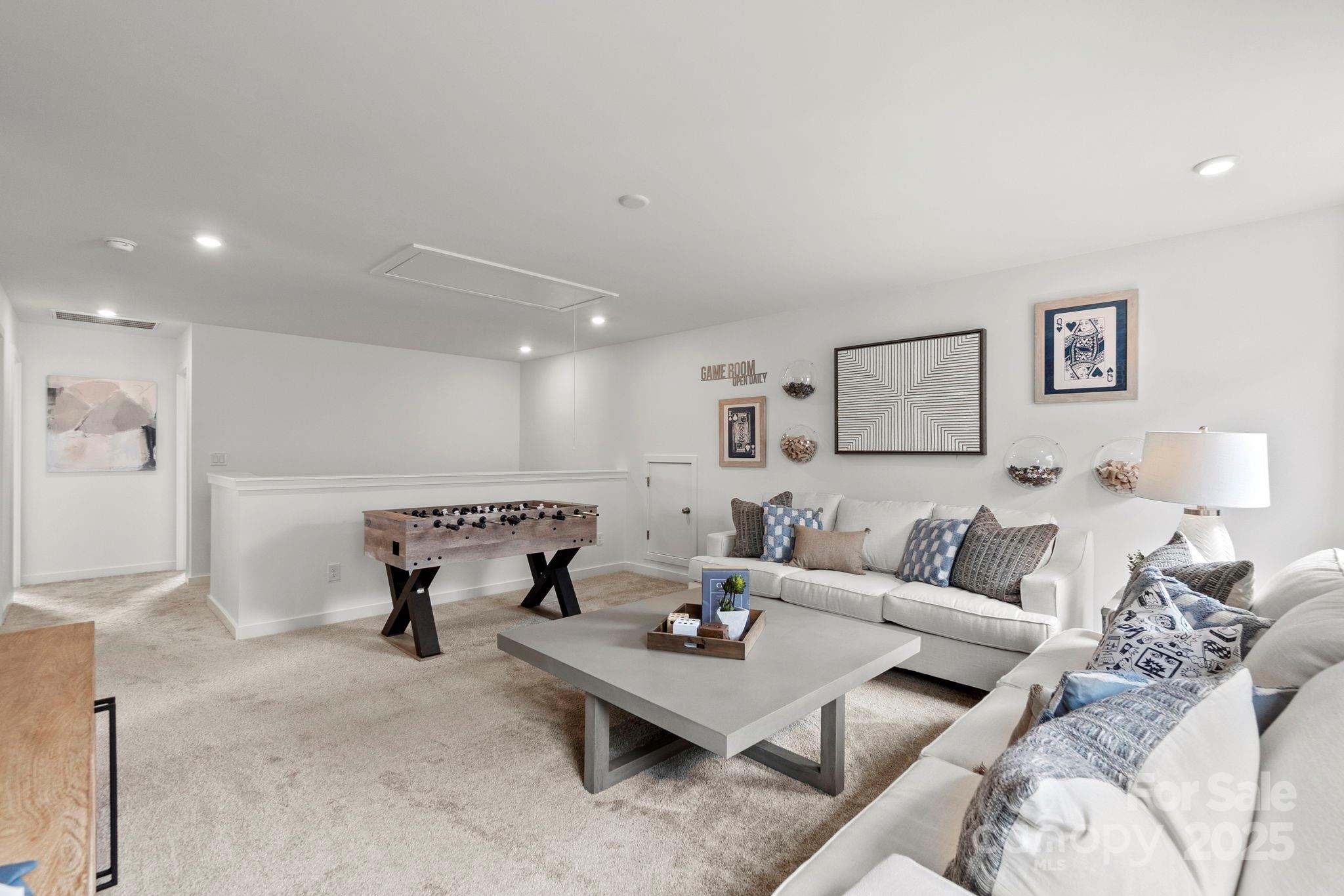 2573 Blue Sky Mdws Drive Monroe, NC 28110 - Photo 21 of 45 a living room with furniture and a table
