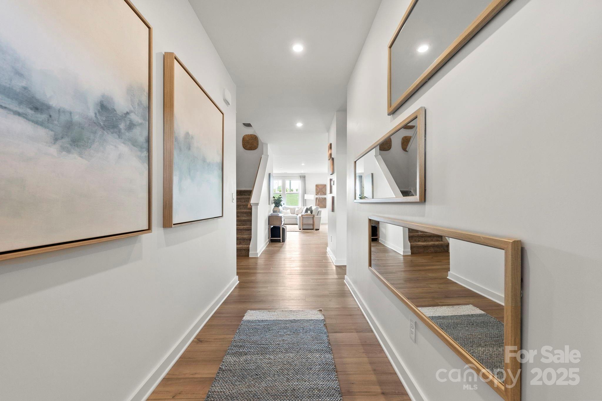 2573 Blue Sky Mdws Drive Monroe, NC 28110 - Photo 3 of 45 a view of entryway and hall with wooden floor