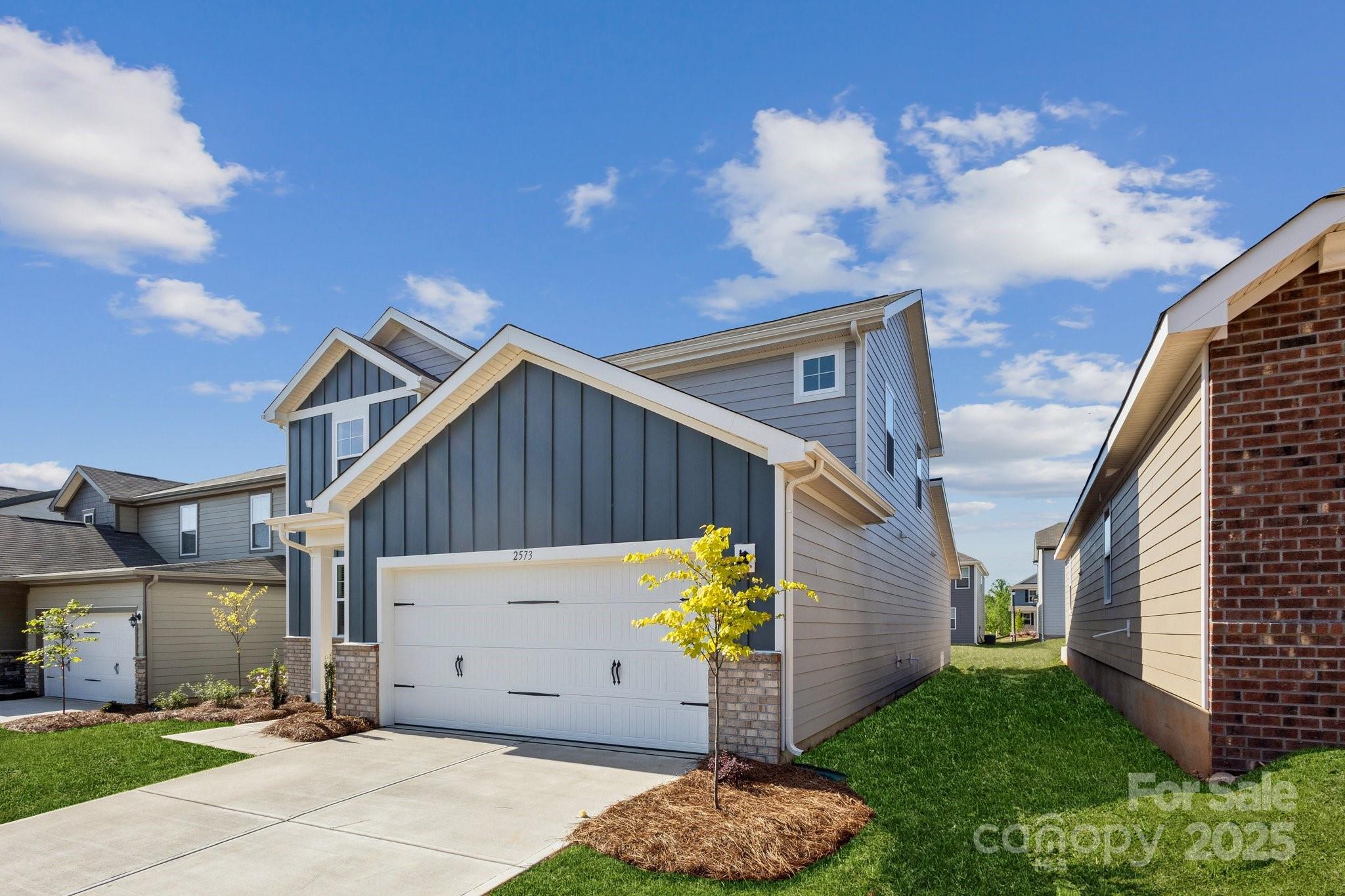 2573 Blue Sky Mdws Drive Monroe, NC 28110 - Photo 35 of 45 a house view with a garden space