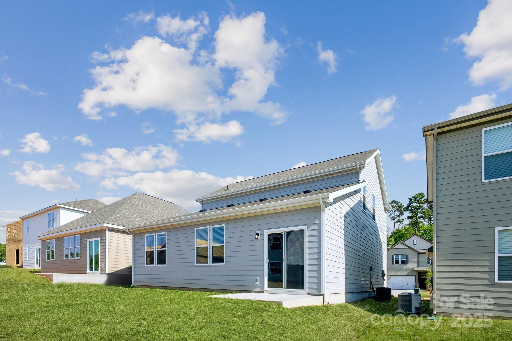 2573 Blue Sky Mdws Drive Monroe, NC 28110 - Photo 37 of 45 a front view of a house with garden