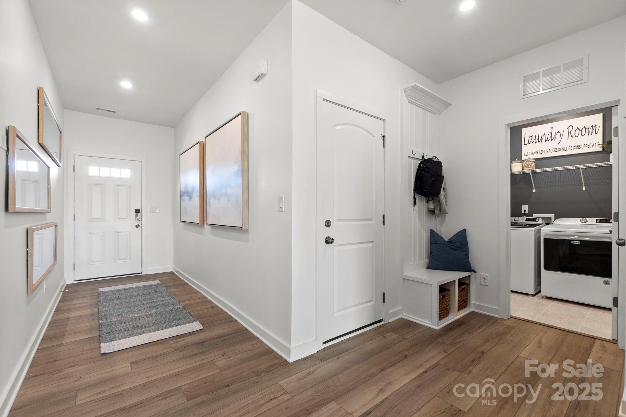 2573 Blue Sky Mdws Drive Monroe, NC 28110 - Photo 4 of 45 a view of entryway with kitchen and wooden floor