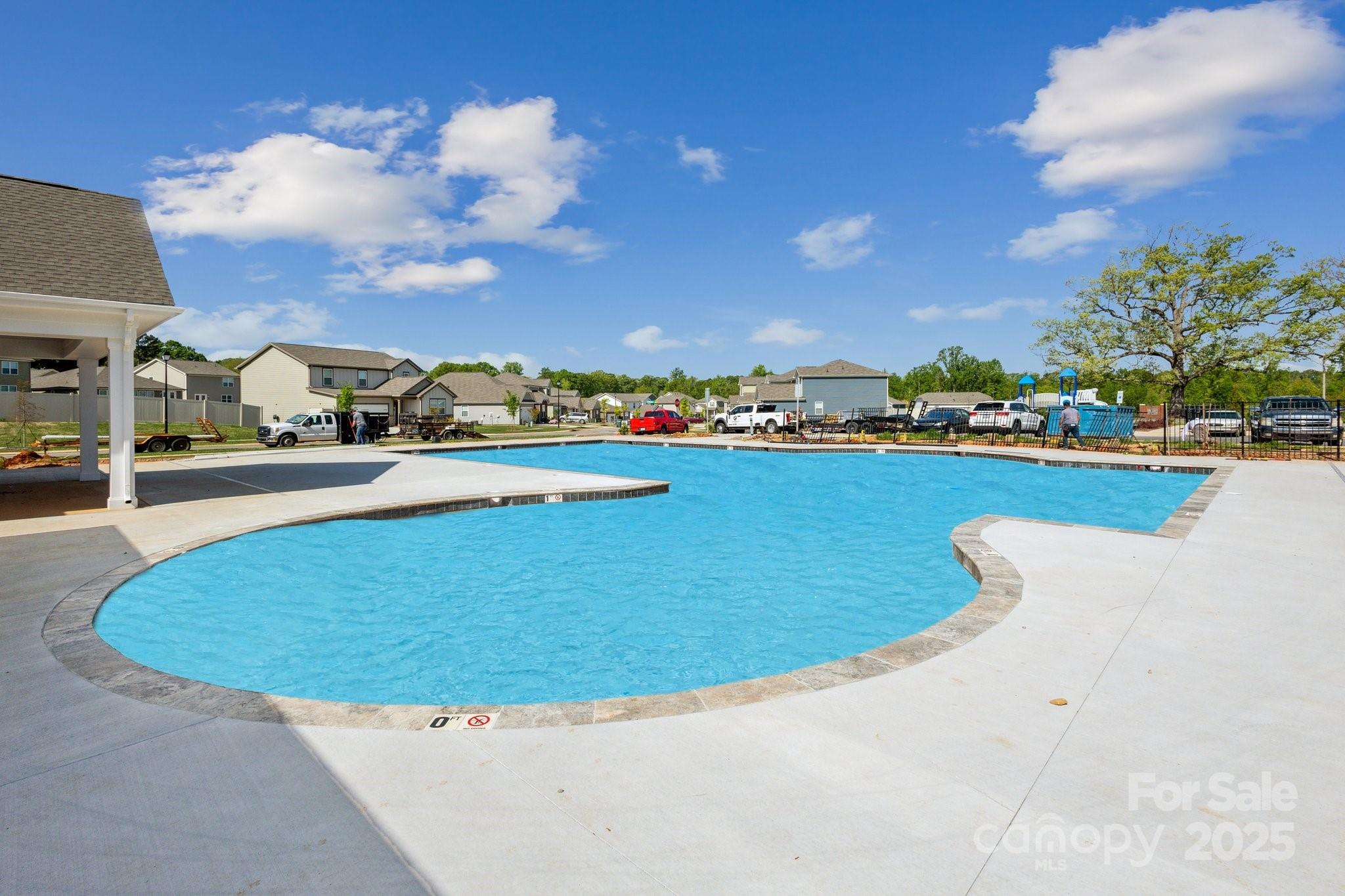 2573 Blue Sky Mdws Drive Monroe, NC 28110 - Photo 42 of 45 a view of a swimming pool and an outdoor seating
