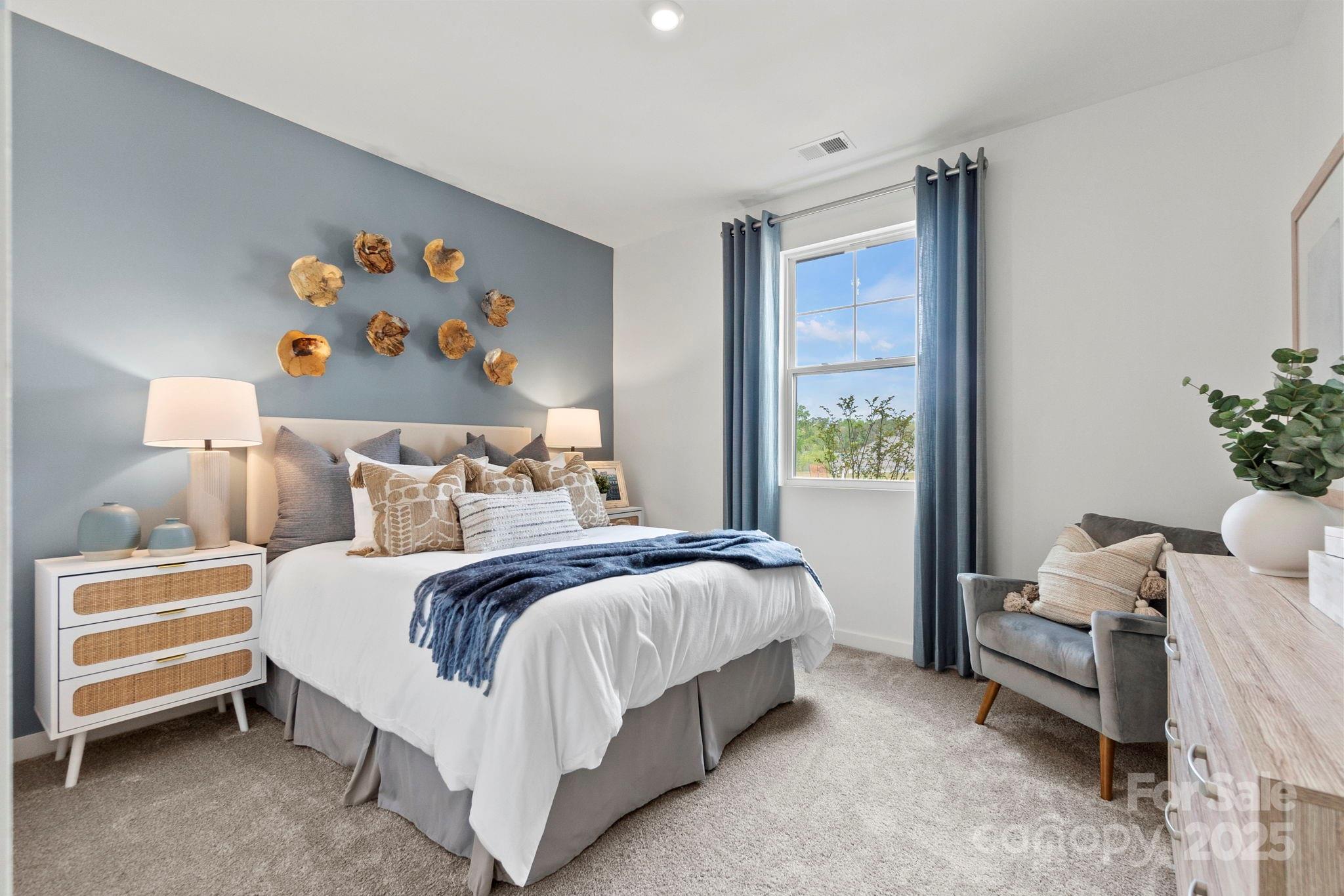 2573 Blue Sky Mdws Drive Monroe, NC 28110 - Photo 6 of 45 a bedroom with a bed and a window