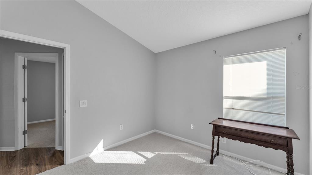 2729 Pankaw Lane Valrico, FL 33596 - Photo 23 of 41 a hallway view with wooden floor and a window