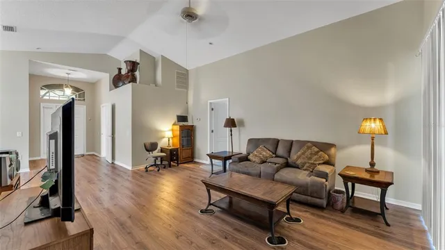 a living room with furniture and a lamp