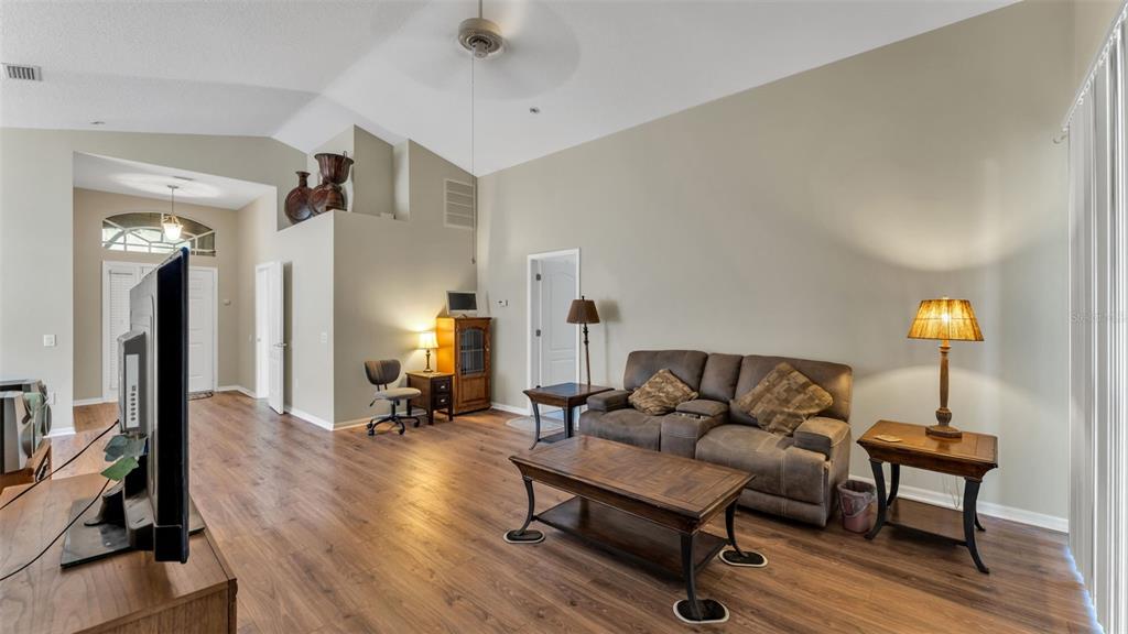 2729 Pankaw Lane Valrico, FL 33596 - Photo 26 of 41 a living room with furniture and a lamp