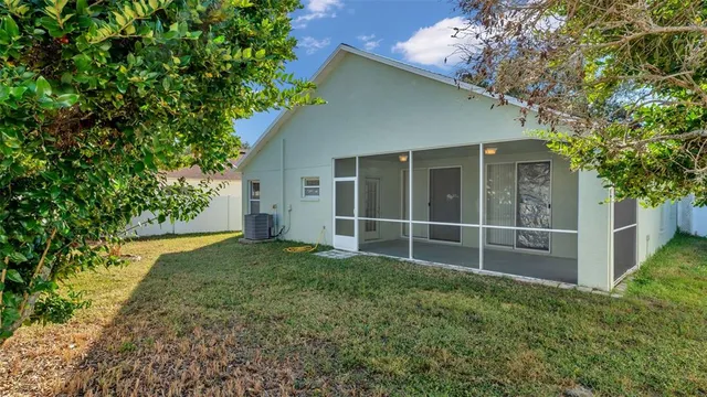 a view of a house with backyard and garden