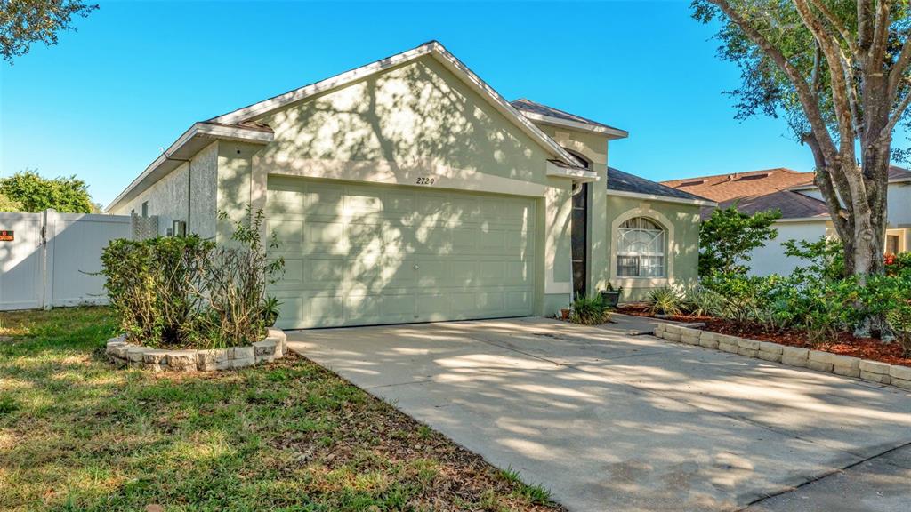 2729 Pankaw Lane Valrico, FL 33596 - Photo 35 of 41 a front view of a house with garden