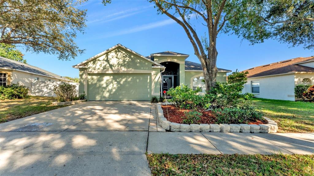 2729 Pankaw Lane Valrico, FL 33596 - Photo 38 of 41 a front view of a house with garden