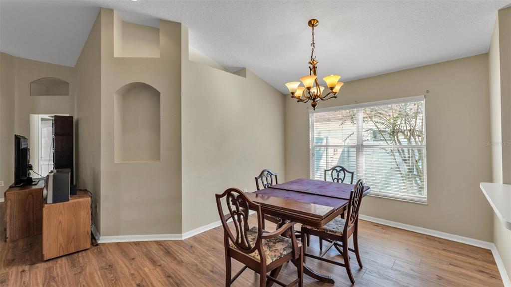 2729 Pankaw Lane Valrico, FL 33596 - Photo 8 of 41 a dining room with furniture and window