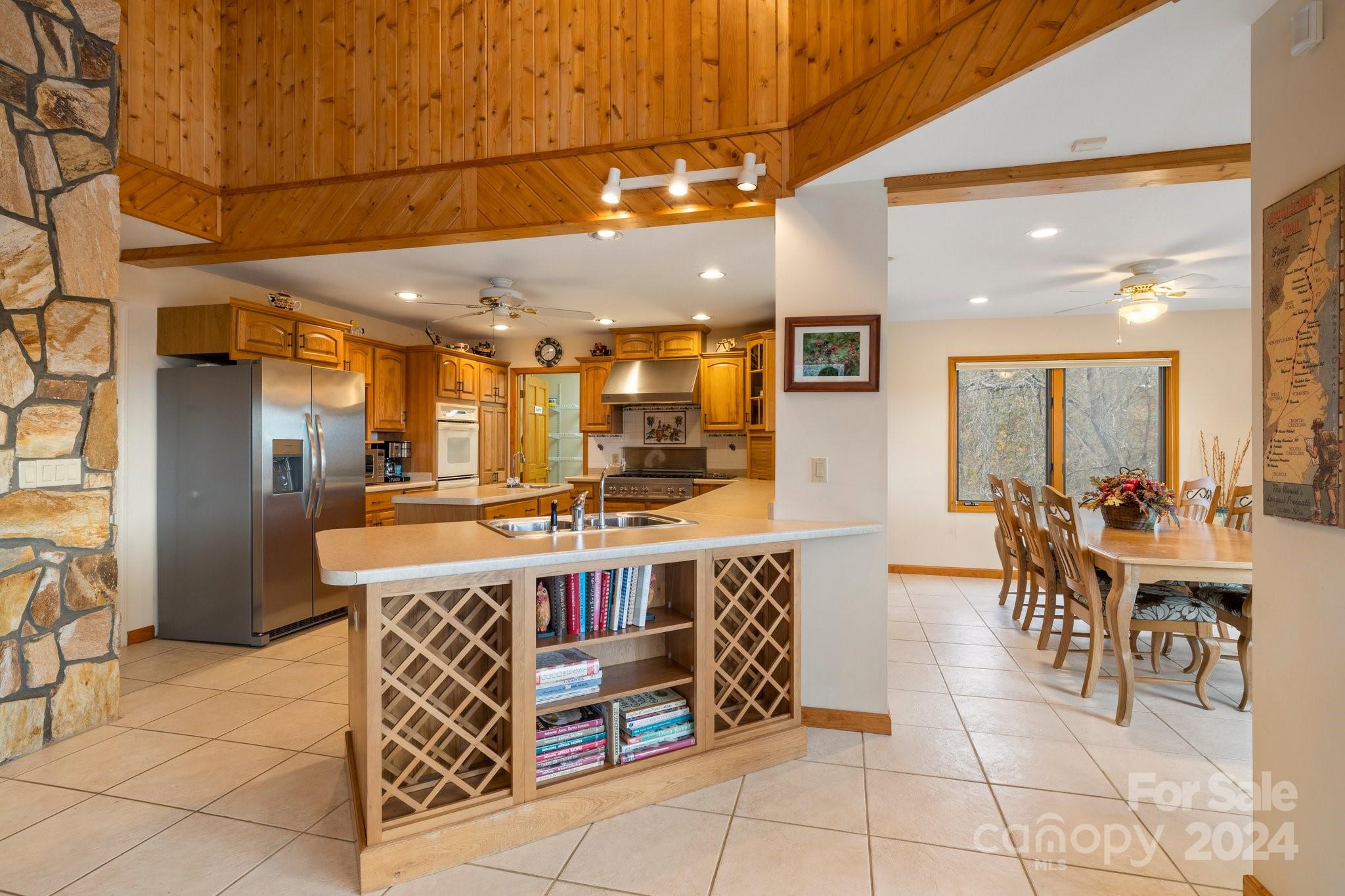 425 Turkey Run Bryson City, NC 28713 - Photo 17 of 47 a large kitchen with a table and chairs
