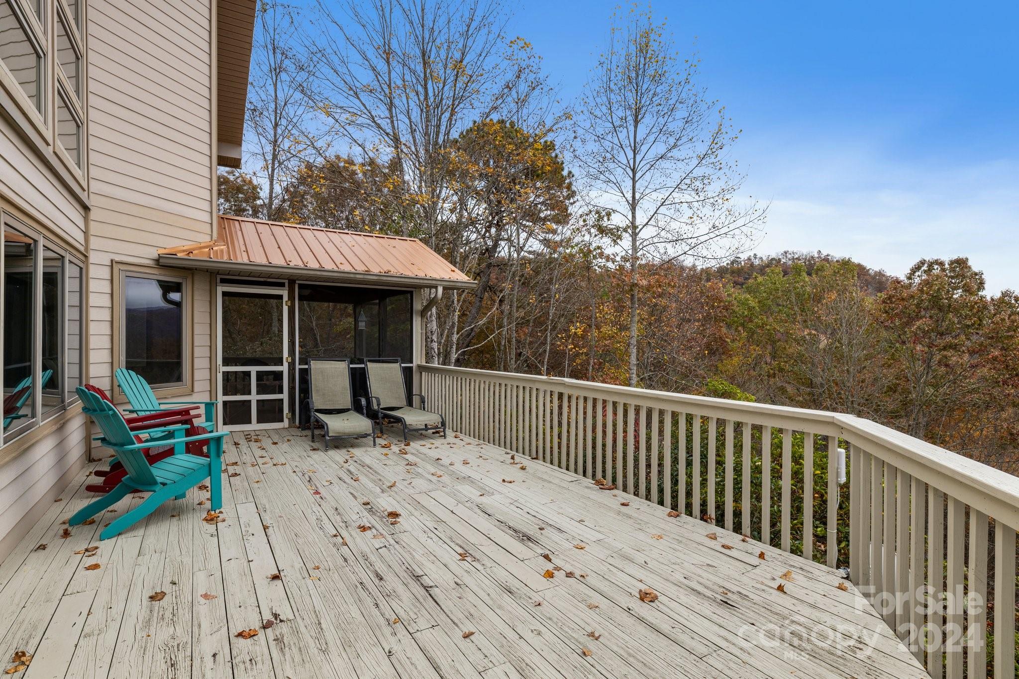 425 Turkey Run Bryson City, NC 28713 - Photo 22 of 47 a view of house with deck outdoor seating and covered with snow in the background