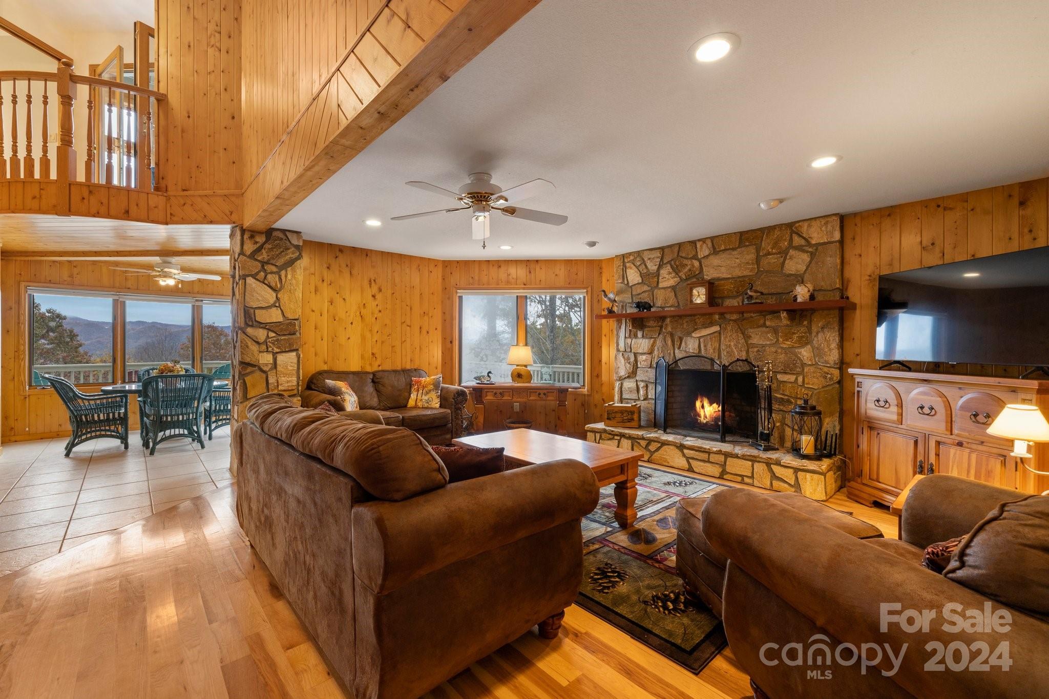 425 Turkey Run Bryson City, NC 28713 - Photo 25 of 47 a living room with fireplace furniture and a flat screen tv