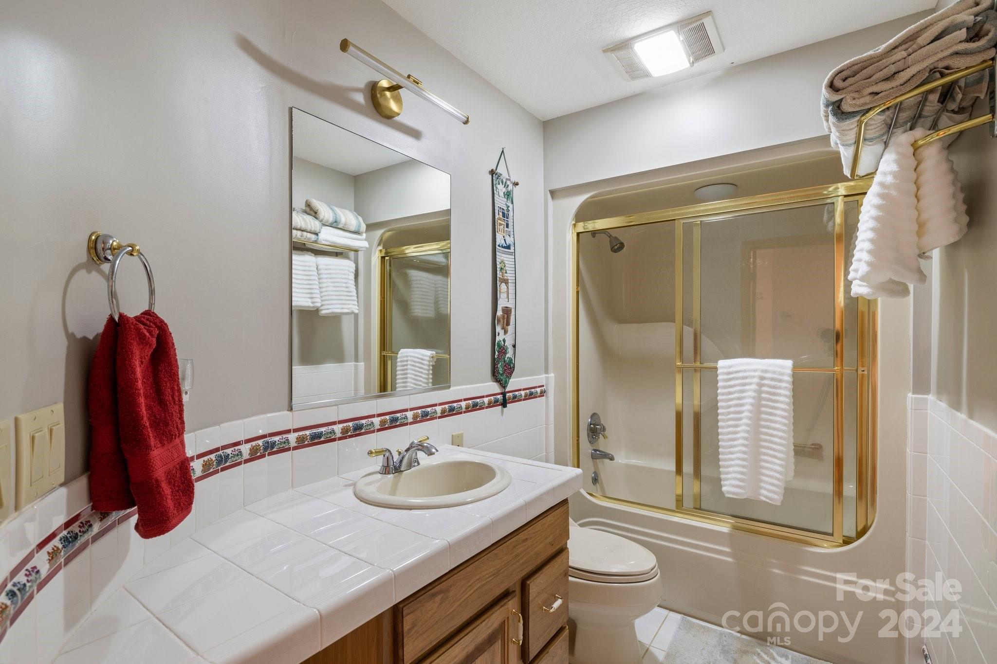 425 Turkey Run Bryson City, NC 28713 - Photo 28 of 47 a bathroom with a sink a toilet and shower