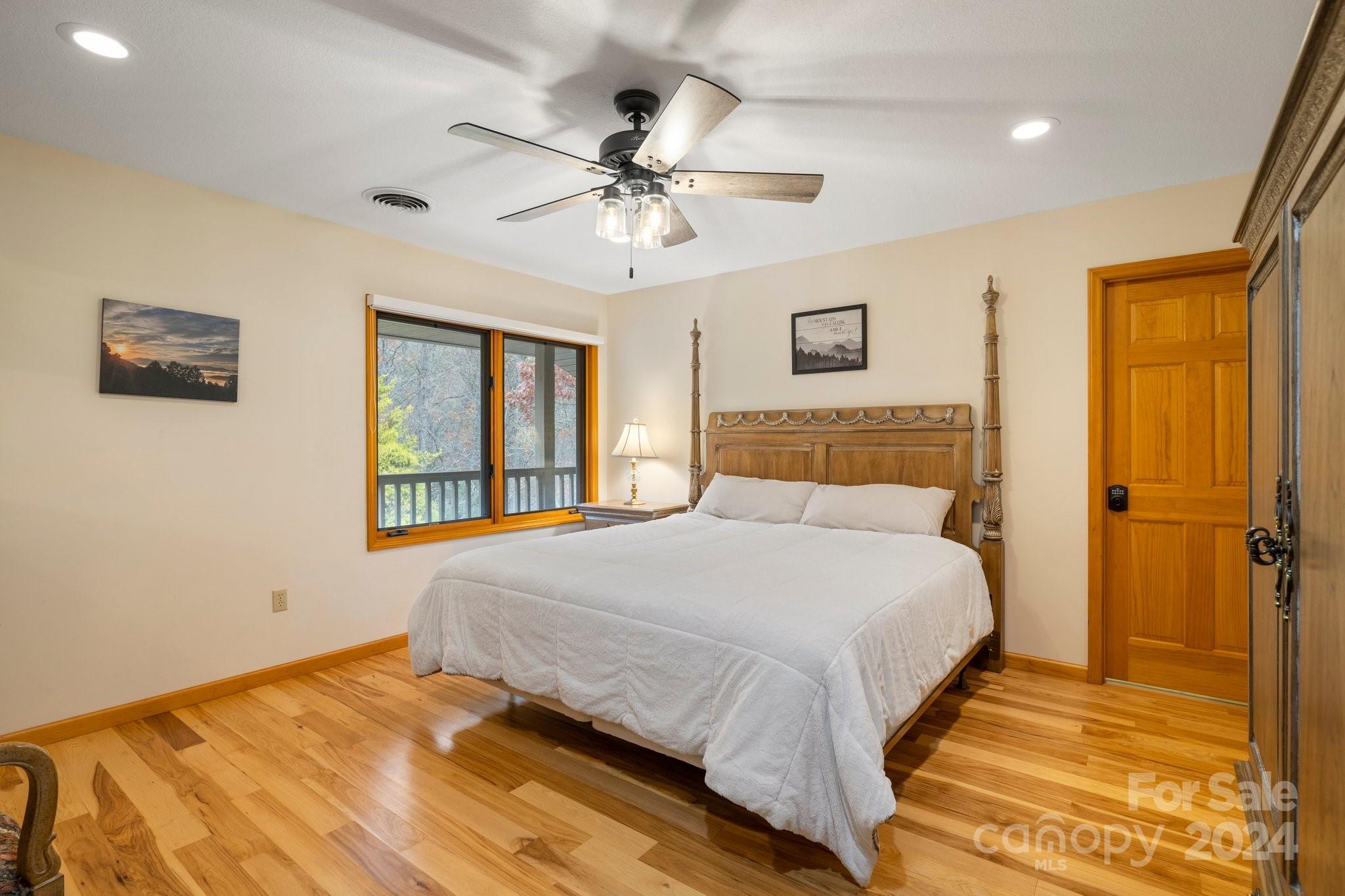 425 Turkey Run Bryson City, NC 28713 - Photo 37 of 47 a bedroom with a large bed and a window