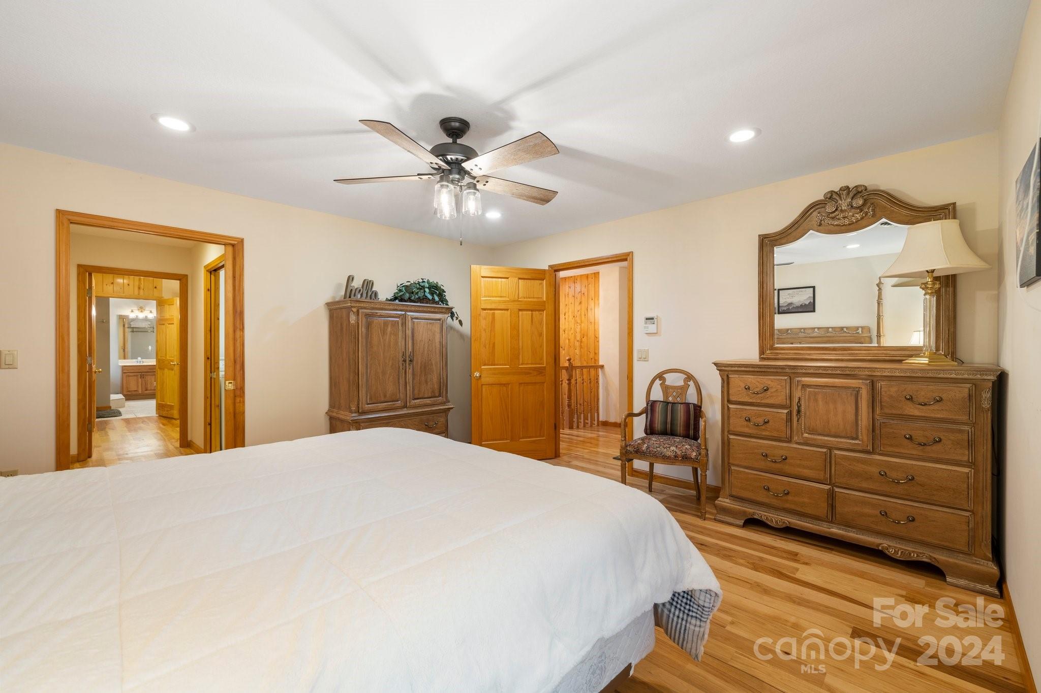 425 Turkey Run Bryson City, NC 28713 - Photo 38 of 47 a bedroom with a bed and a chandelier