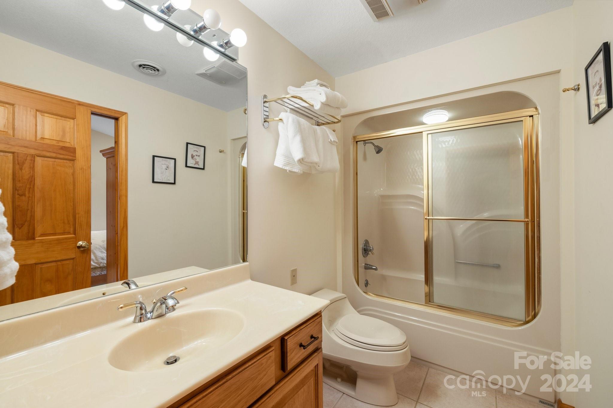 425 Turkey Run Bryson City, NC 28713 - Photo 40 of 47 a bathroom with a sink a toilet and shower