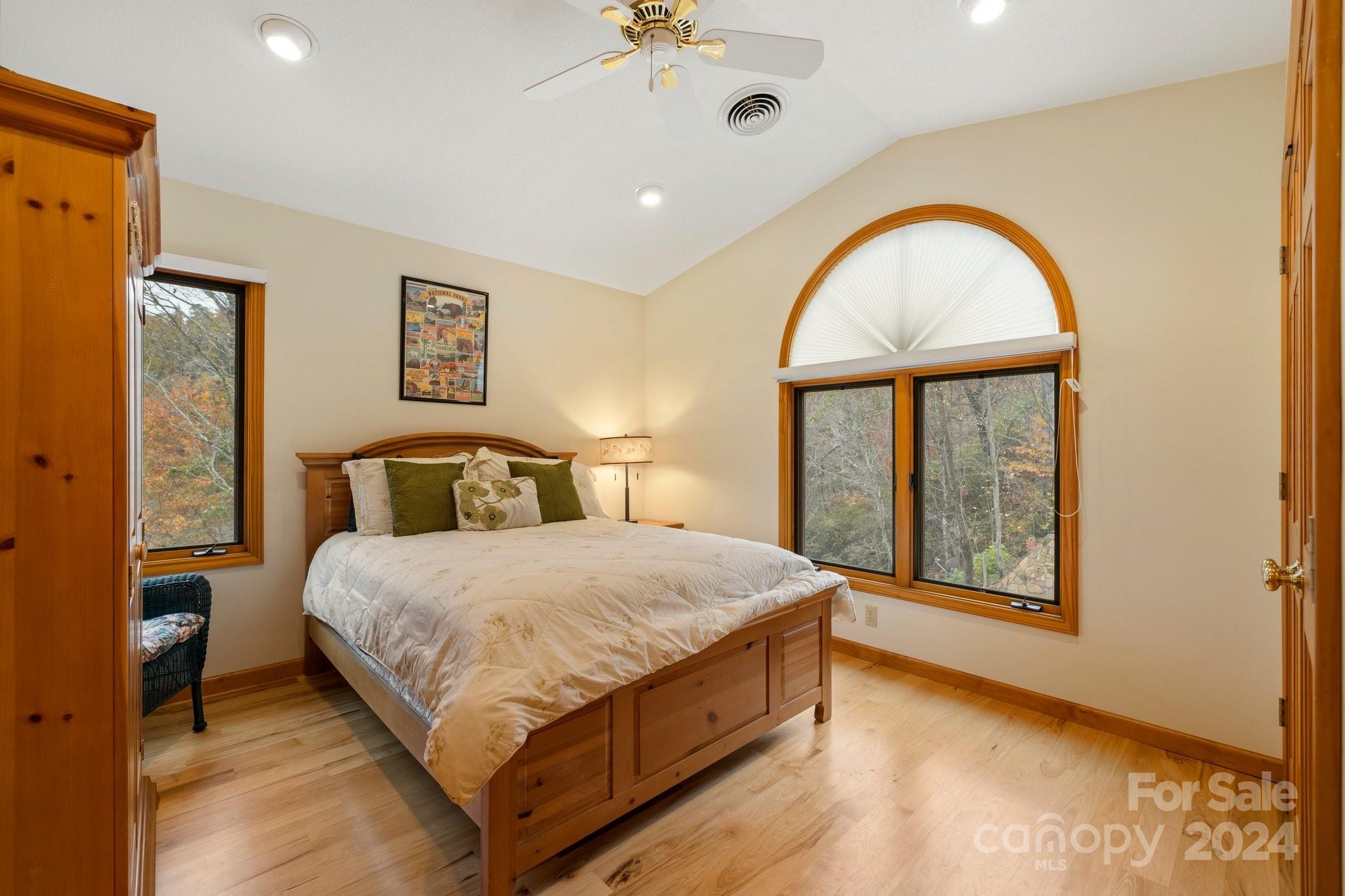 425 Turkey Run Bryson City, NC 28713 - Photo 41 of 47 a bedroom with a large bed and a window