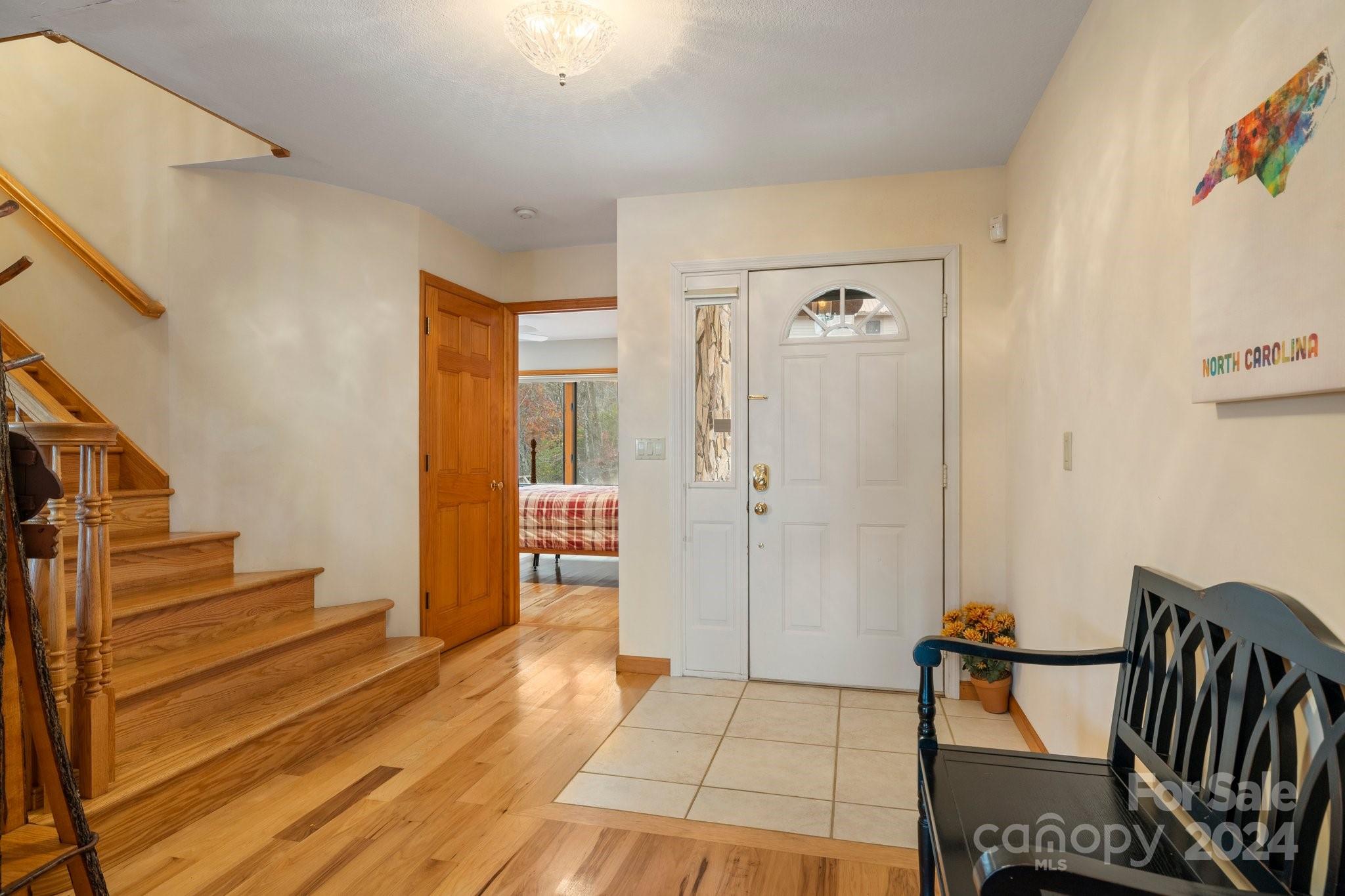 425 Turkey Run Bryson City, NC 28713 - Photo 9 of 47 a view of a hallway with wooden floor and staircase