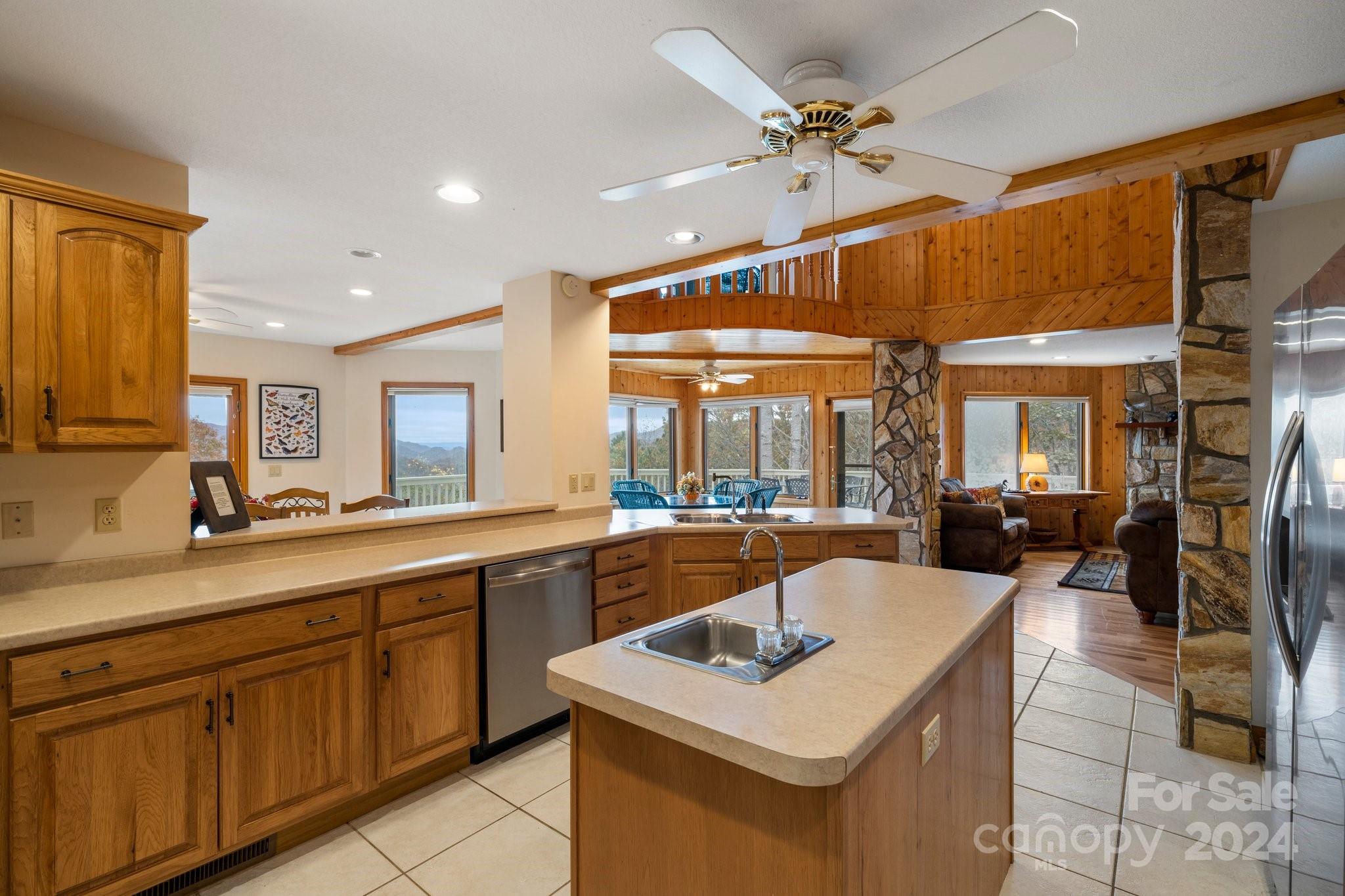 425 Turkey Run Bryson City, NC 28713 - Photo 10 of 47 a kitchen with a sink a counter top space and living room view