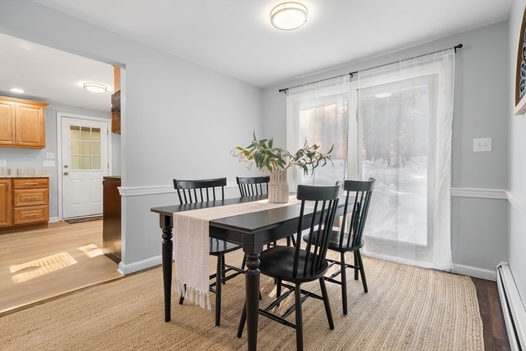 98 West Street Georgetown, MA 01833 - Photo 11 of 39 a view of a dining room with furniture and wooden floor