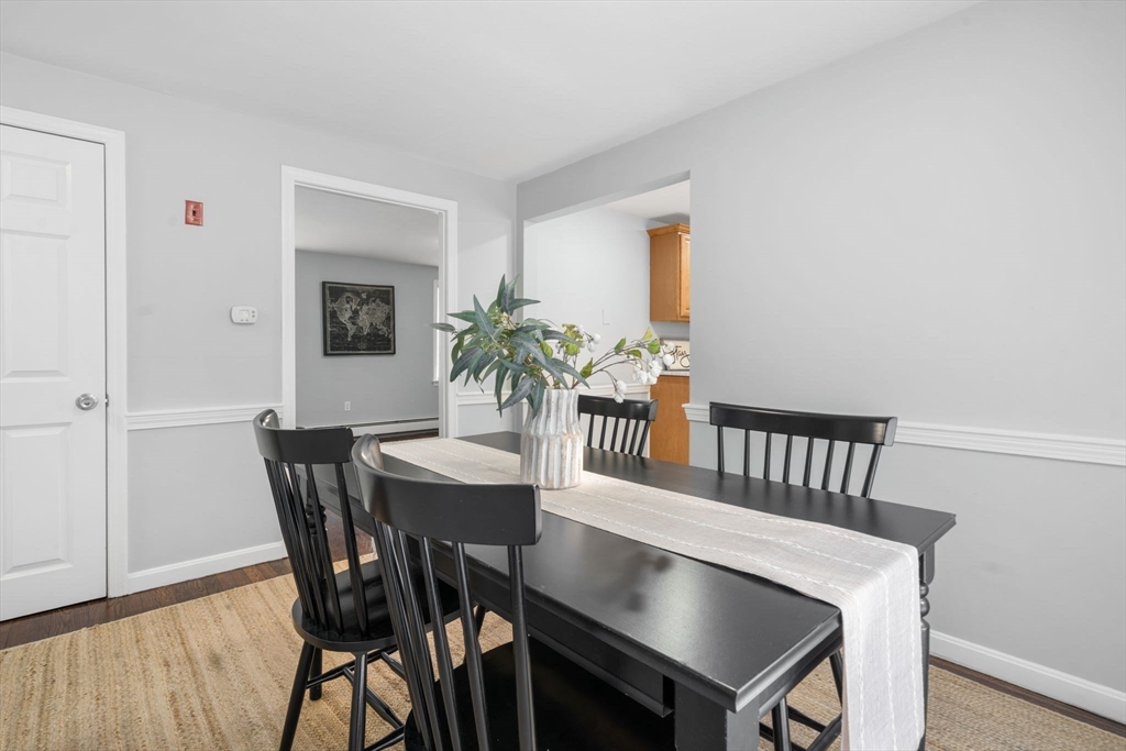 98 West Street Georgetown, MA 01833 - Photo 12 of 39 a view of a dining room with furniture and wooden floor