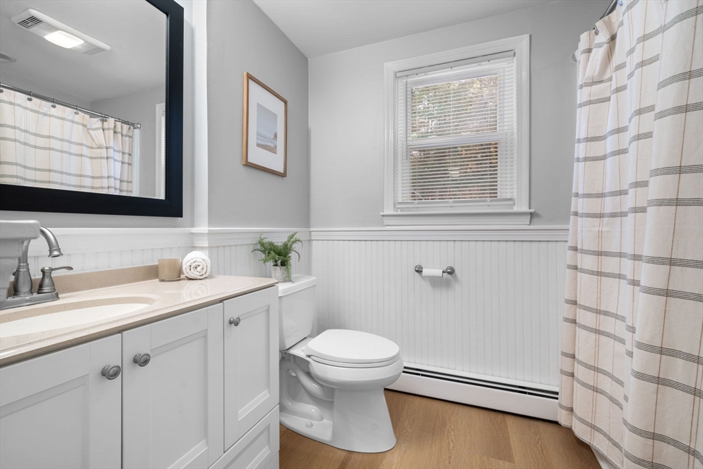 98 West Street Georgetown, MA 01833 - Photo 19 of 39 a bathroom with a granite countertop sink toilet and mirror
