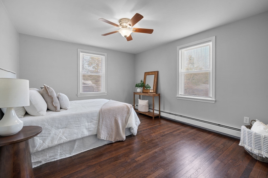 98 West Street Georgetown, MA 01833 - Photo 20 of 39 a bedroom with a bed and wooden floor