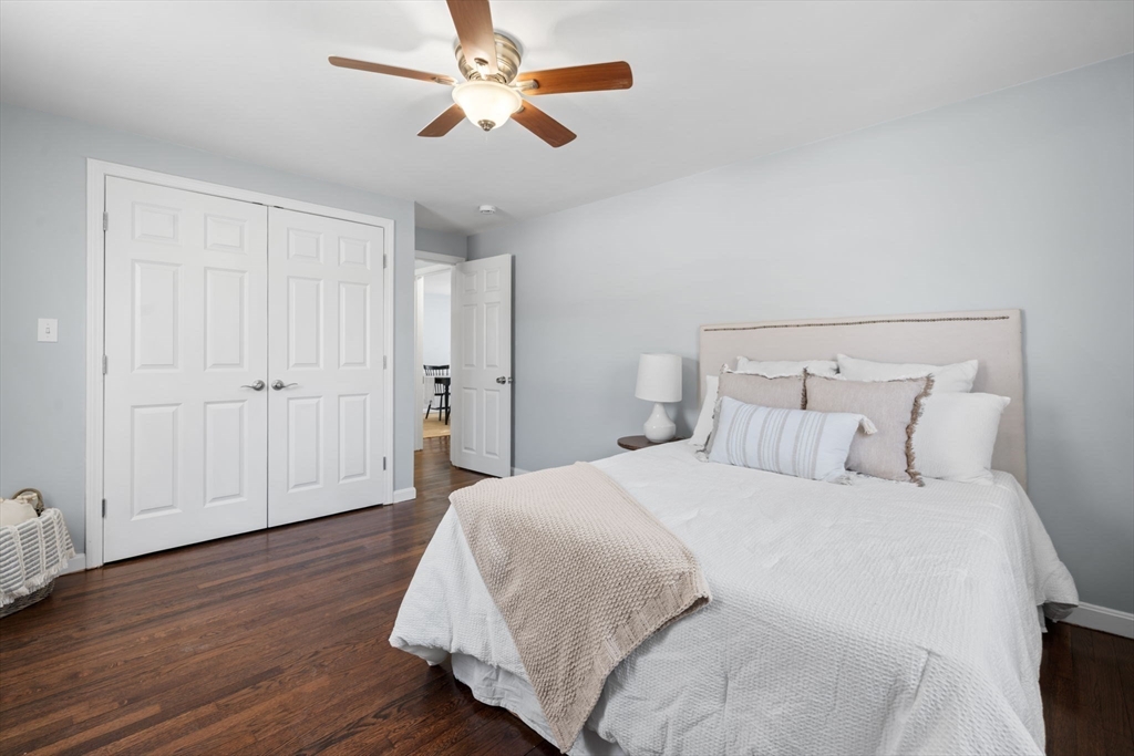 98 West Street Georgetown, MA 01833 - Photo 22 of 39 a spacious bedroom with a bed and a ceiling fan