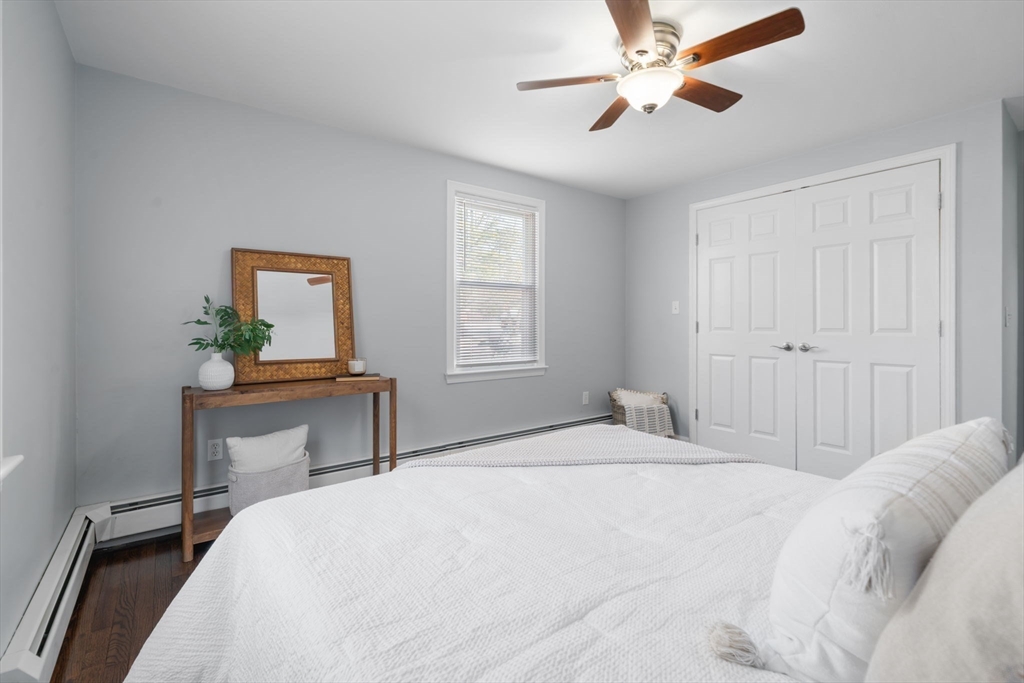 98 West Street Georgetown, MA 01833 - Photo 23 of 39 a bedroom with a bed table and a window