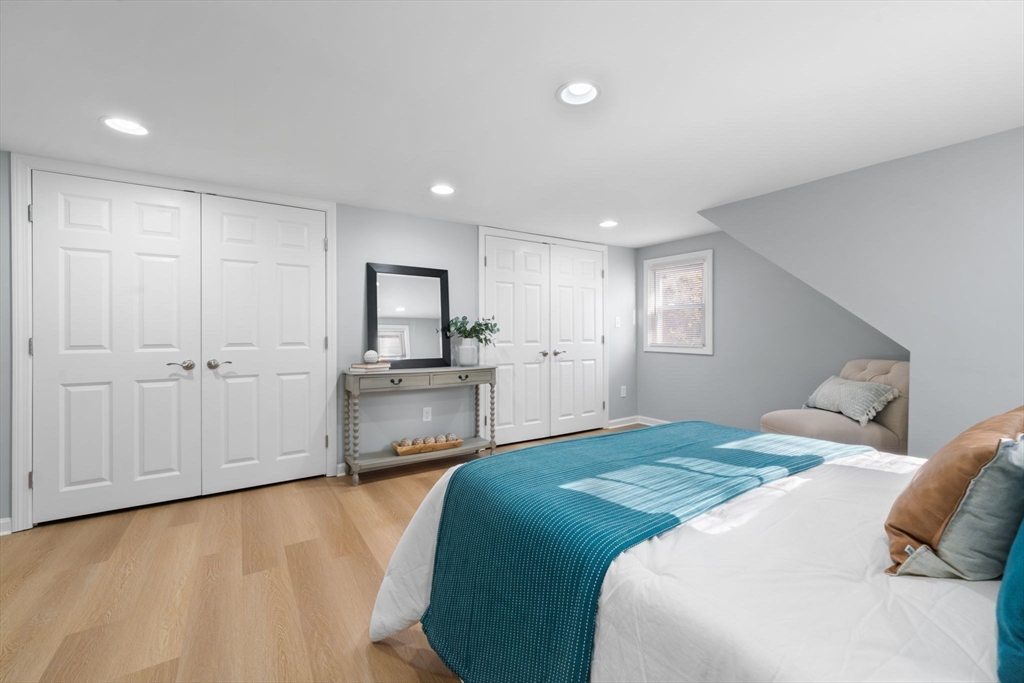 98 West Street Georgetown, MA 01833 - Photo 29 of 39 a bedroom with a bed and a view of kitchen