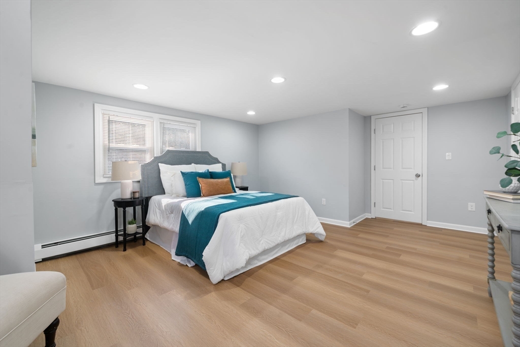 98 West Street Georgetown, MA 01833 - Photo 30 of 39 a bedroom with a large bed and a window