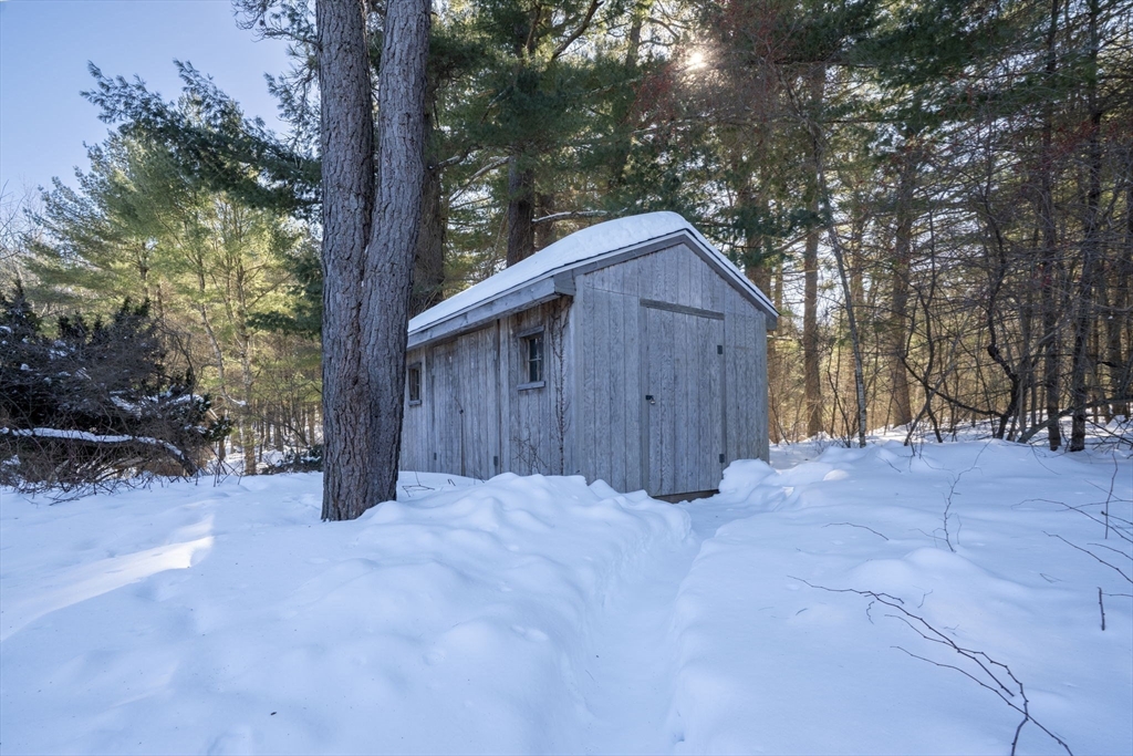 98 West Street Georgetown, MA 01833 - Photo 37 of 39 a view of wooden house with large trees and wooden fence