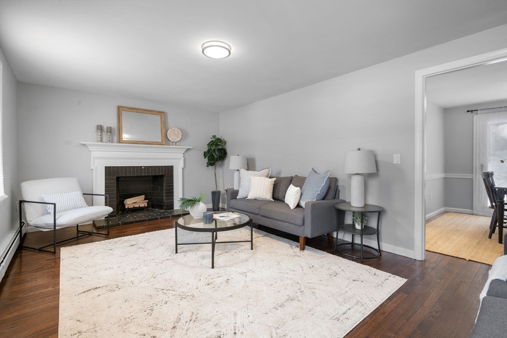 98 West Street Georgetown, MA 01833 - Photo 6 of 39 a living room with furniture and a fireplace