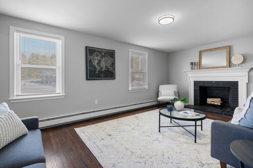 98 West Street Georgetown, MA 01833 - Photo 7 of 39 a living room with furniture and a fireplace