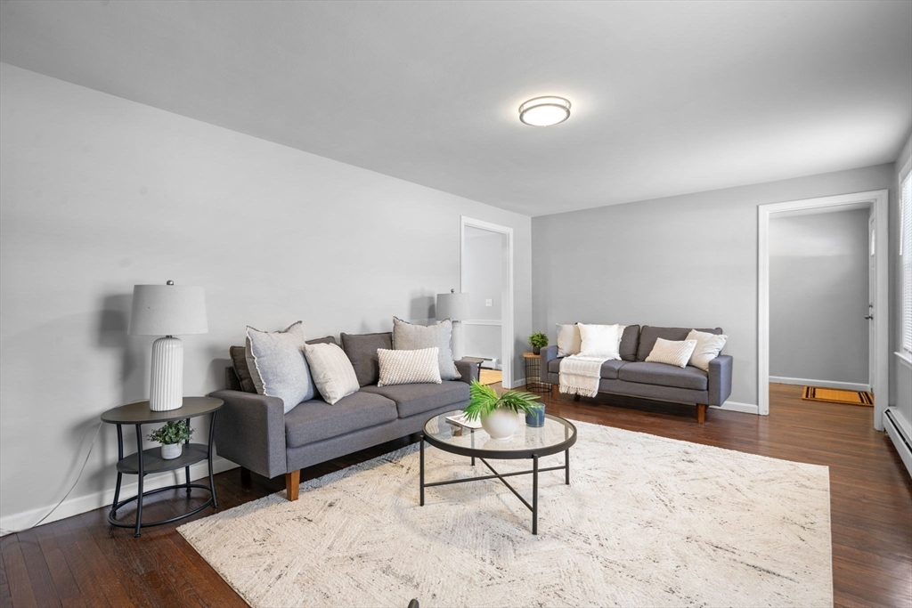 98 West Street Georgetown, MA 01833 - Photo 8 of 39 a living room with furniture and a wooden floor