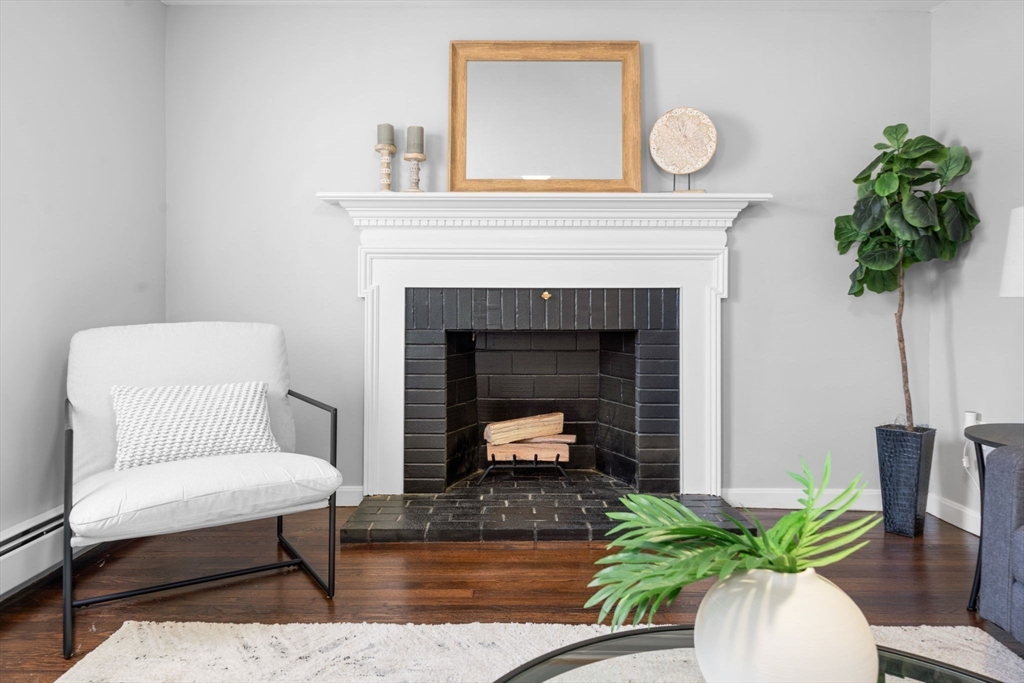 98 West Street Georgetown, MA 01833 - Photo 9 of 39 a living room with furniture and a fireplace