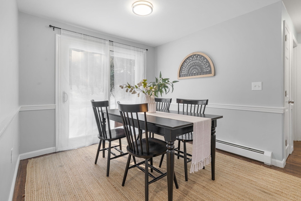 98 West Street Georgetown, MA 01833 - Photo 10 of 39 a view of a dining room with furniture and wooden floor