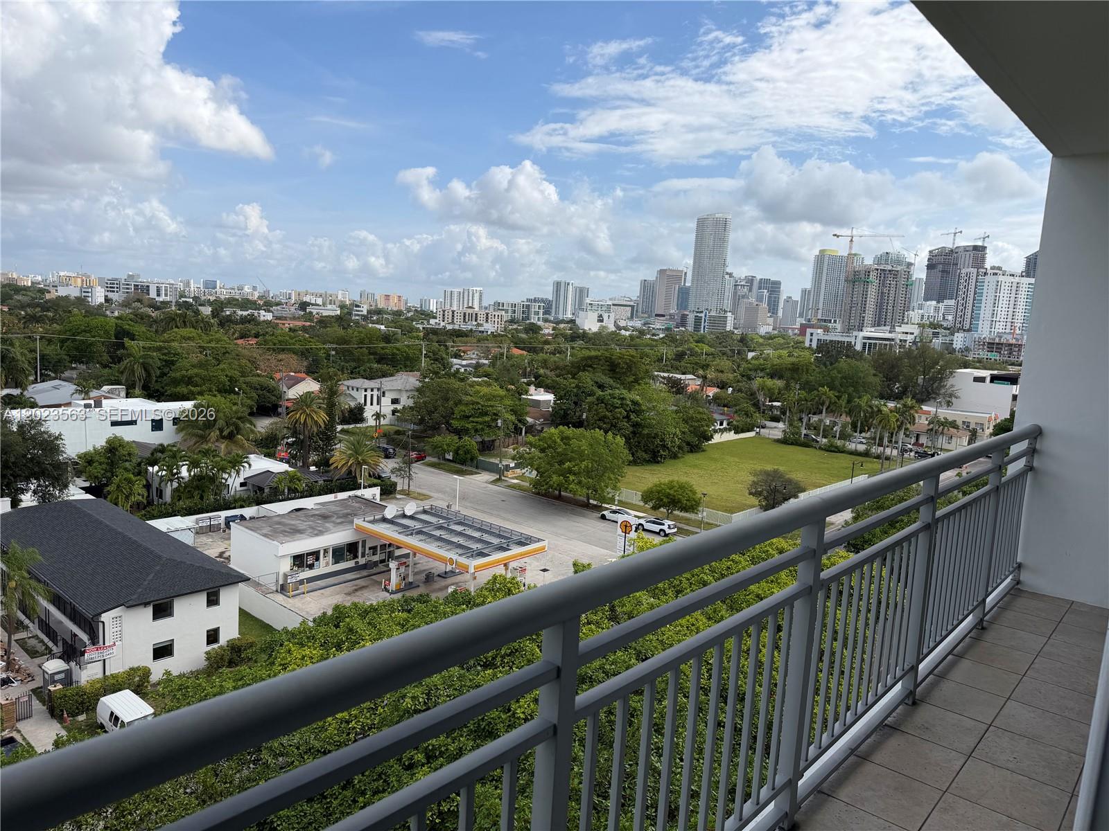 2021 Southwest 3rd Avenue, Unit 902 Miami, FL 33129 - Photo 1 of 14 a city view from a balcony with furniture