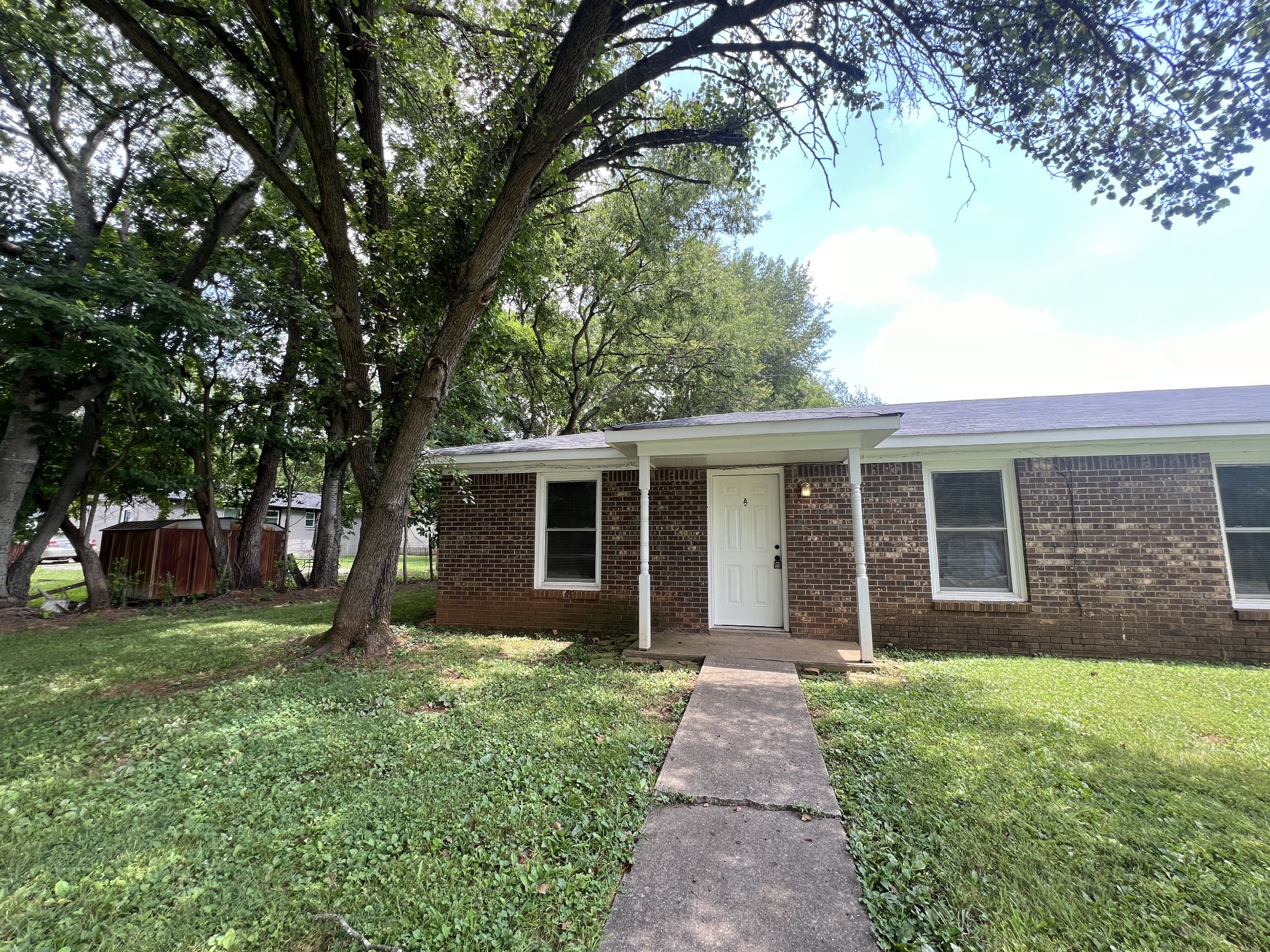 front view of a house with a yard