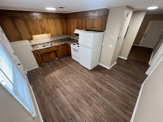 a kitchen with a sink and a stove top oven