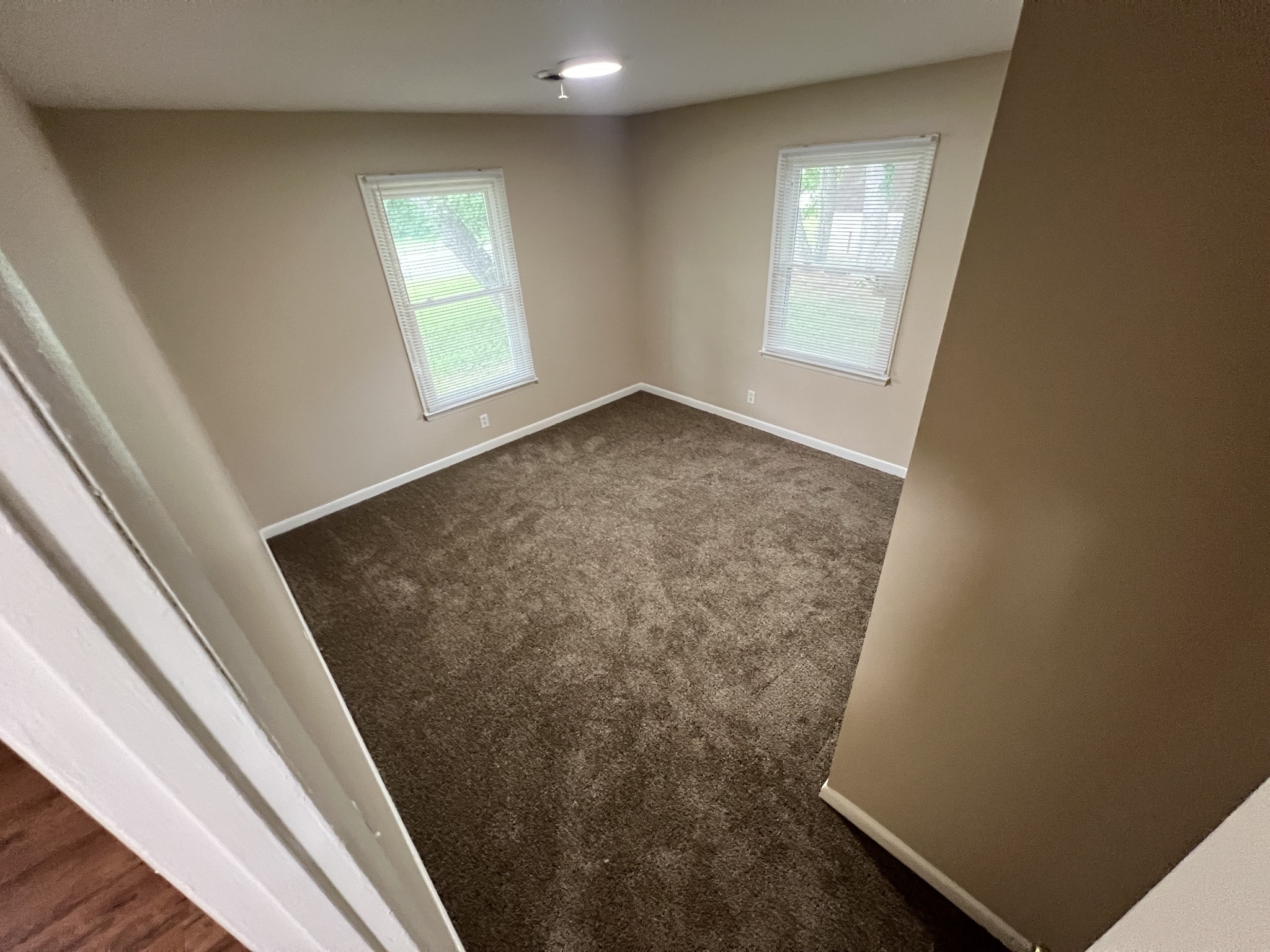 707 Riviera Drive, Unit A Murfreesboro, TN 37130 - Photo 8 of 9 wooden floor in an empty room with a window