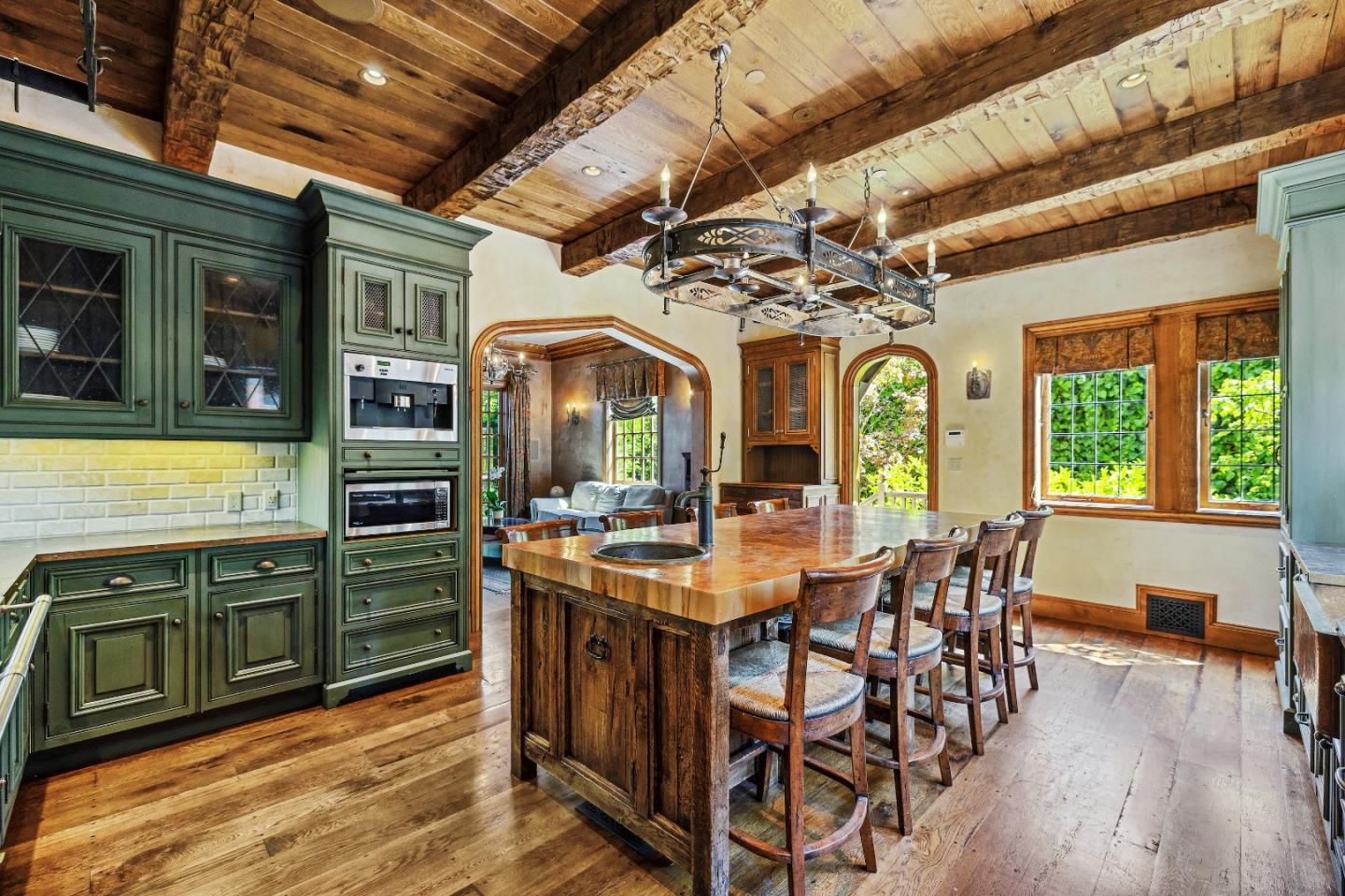 446 El Arroyo Road Hillsborough, CA 94010 - Photo 13 of 32 a view of a dining room with furniture window and wooden floor