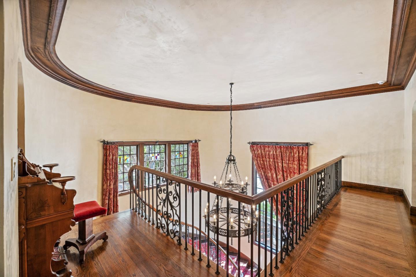 446 El Arroyo Road Hillsborough, CA 94010 - Photo 16 of 32 a view of a hallway with wooden floor and stairs