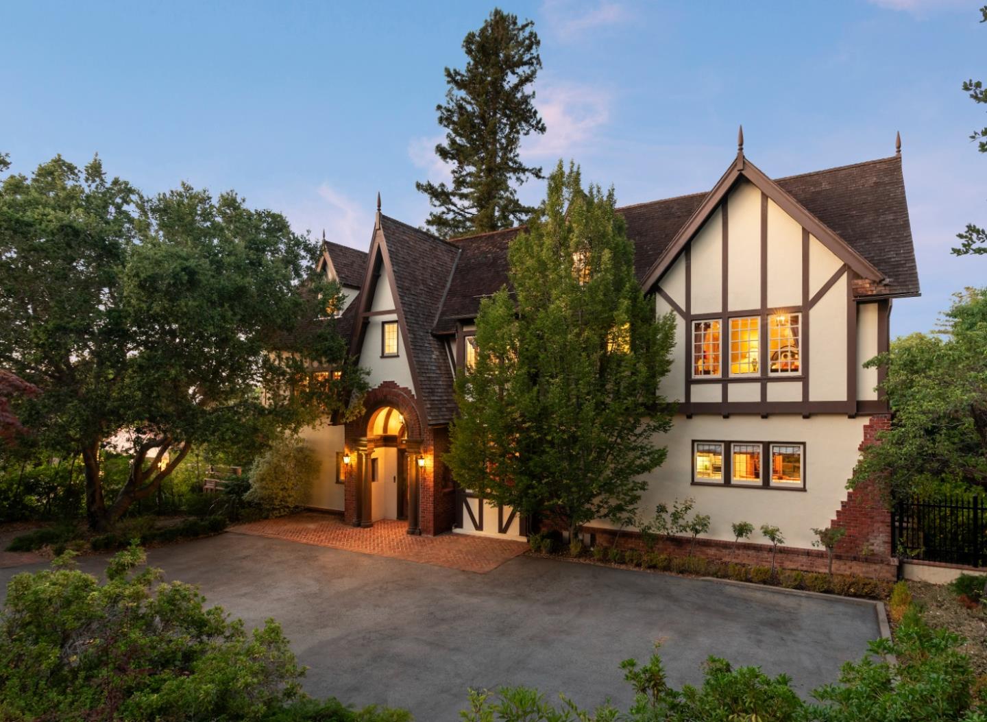 446 El Arroyo Road Hillsborough, CA 94010 - Photo 3 of 32 a front view of a house with a yard and tree s